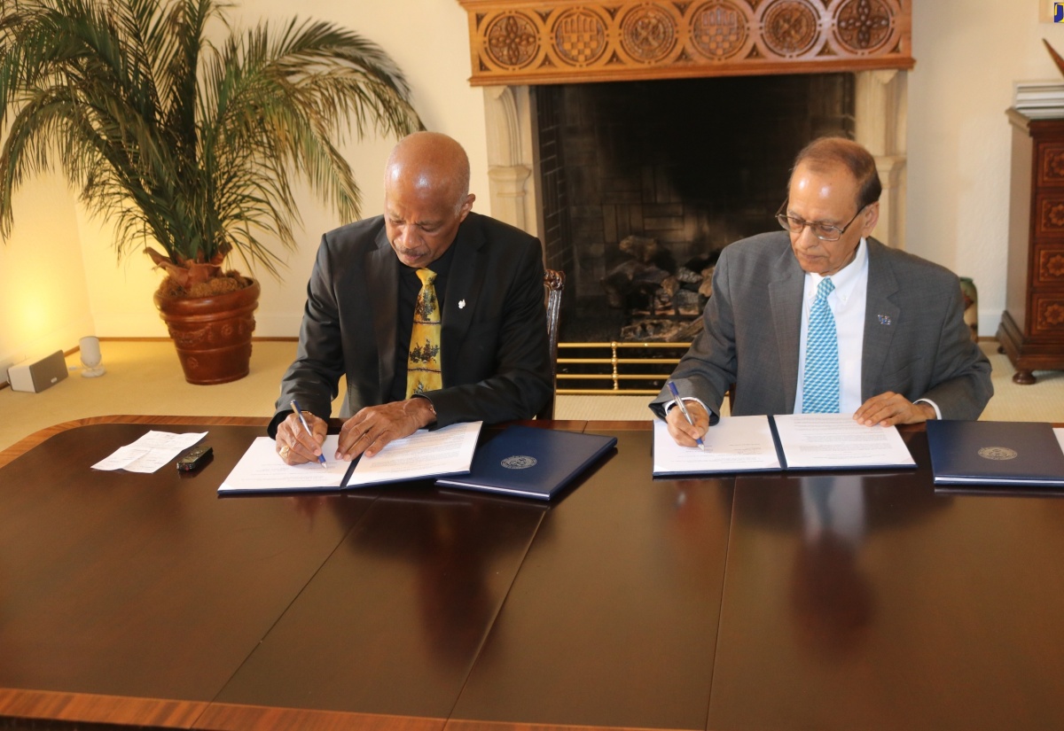 University of the West Indies (UWI) Vice Chancellor, Professor Sir Hilary Beckles and State University of New York at Buffalo (SUNY) President, Satish K. Tripathi, sign a memorandum of understanding (MOU) between the two universities to foster greater cooperation. The signing took place in Buffalo, New York, on Monday (May 20).