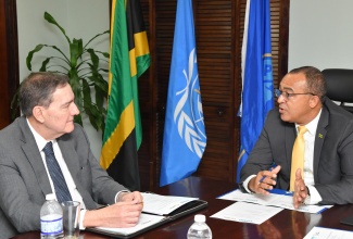 Minister of Health and Wellness, Dr. the Hon. Christopher Tufton (right), engages in conversation with Director of the Pan American Health Organization (PAHO) and World Health Organization (WHO) Regional Director for the Americas, Dr. Jarbas Barbosa da Silva Jr., during a courtesy call at the Ministry’s New Kingston offices on Monday (May 6). Dr. Barbosa is in Jamaica to participate in a series of activities with the Ministry. 