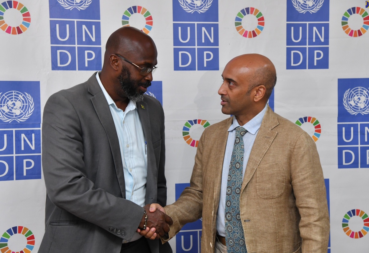 Acting Director General for the Office of Disaster Preparedness and Emergency Management (ODPEM), Richard Thompson (left), greets United Nations Development Programme (UNDP) Resident Representative, Kishan Khoday, during Friday’s (May 17) UNDP Disaster Risk Resilience Knowledge Exchange. The session was held at the UNDP’s Lady Musgrave Road offices in Kingston. 