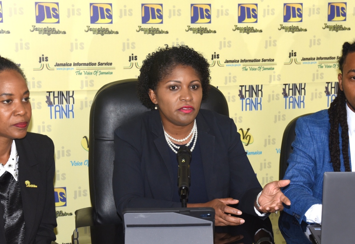 Executive Director, National Education Trust (NET), Latoya Harris Ghartey (centre), addresses a Jamaica Information Service (JIS) ‘Think Tank’ at the agency’s head office in Kingston on Tuesday (May 28). Listening (from left) are: Net Directors in charge of Donor and Partnership Management, Keisha Johnson, and Infrastructure Management, Christopher Wilson.