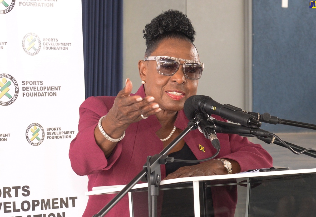 Minister of Culture, Gender, Entertainment and Sport, Hon. Olivia Grange, addresses the official handover of a multipurpose court at Christel House in St. Catherine, on June 4.