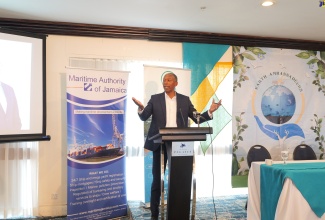 Director General of the Maritime Authority of Jamaica, Bertrand Smith addresses the recent world Oceans Day Ceremony held at the Jamaica Pegasus Hotel, in New Kingston.