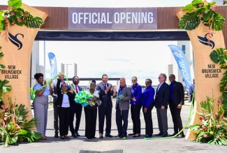 Prime Minister, the Most Hon. Andrew Holness (centre), applauds the official opening of Sagicor Group’s multibillion-dollar New Brunswick Village in Spanish Town, St. Catherine, on Wednesday (June 19). Others celebrating the occasion include Custos of St. Catherine, Icylin M. Golding (second left); Councillor for the Westchester Division, Renair Benjamin (fourth left); Minister of Culture, Gender, Entertainment and Sport and Member of Parliament for St. Catherine Central, Hon. Olivia Grange (fifth left); President and Chief Executive Officer of Sagicor Group, Christopher Zacca (fifth right); and other officials from Sagicor.

