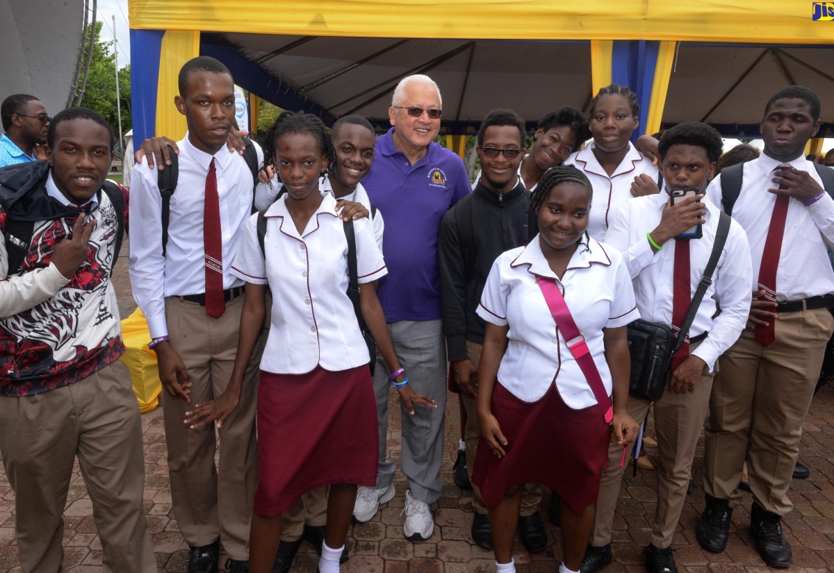 Minister of Justice, Hon. Delroy Chuck (centre), with students at the Legal Aid Council justice fair for persons with disabilities, which was held at Emancipation Park in New Kingston on Friday (June 21).