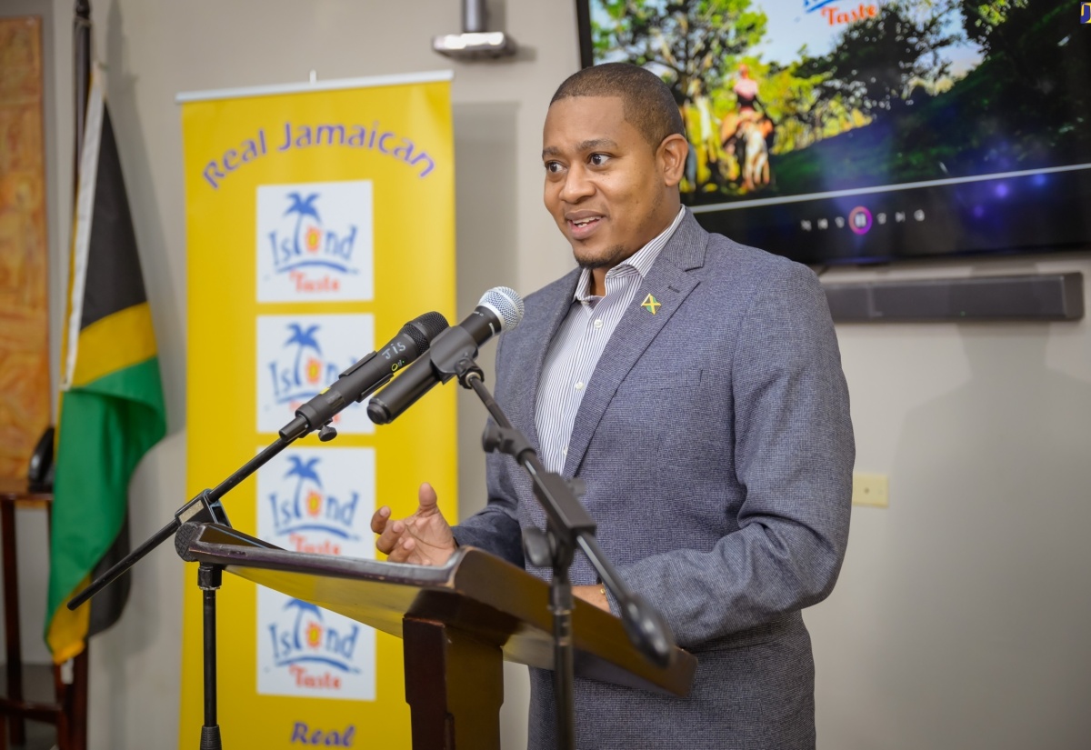 Minister of Agriculture, Fisheries and Mining, Hon. Floyd Green, delivers remarks during Friday’s (June 28) launch of local entity, Tripple C Manufacturing’s ‘Island Taste’ brand of canned soup and meat at the Jamaica Promotions Corporation (JAMPRO) Auditorium in New Kingston.