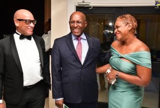 Minister of Industry, Investment and Commerce, Senator the Hon. Aubyn Hill (centre) shares a light moment with incoming President of the Rotary Club of Kingston, Sixto Coy (left) and his wife, Chief Executive Officer, GK Foods International Business, Andrea Coy. Occasion was the Rotary Club of Kingston’s Forensic Installation Ceremony and Banquet on June 27 at The Jamaica Pegasus hotel in Kingston.