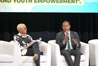 Minister of Agriculture, Fisheries and Mining, Hon. Floyd Green, fields questions from host, Debbie Bissoon, at the ‘Riverside Chat’, held during the 10th Biennial Jamaica Diaspora Conference, at the Montego Bay Convention Centre, on June 18. The Conference is being held from June 16 to June 19.

