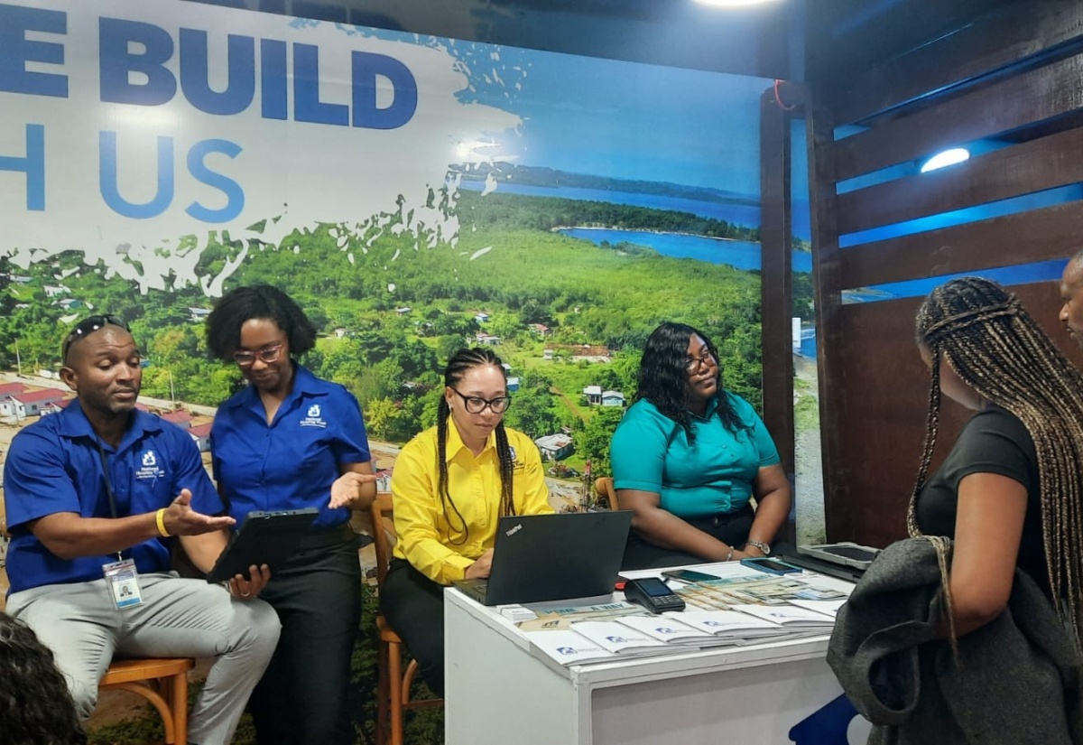 Diaspora members visit the National Housing Trust (NHT) booth during the Biennial Jamaica Diaspora Conference at the Montego Bay Convention Centre in St. James. The NHT is part of the Government-at-Your-Service (GOVAYS)/Marketplace feature of the conference.


