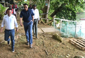 Prime Minister, the Most Hon. Andrew Holness (centre); Minister without Portfolio in the Ministry of Economic Growth and Job Creation, Senator the Hon. Matthew Samuda (left), and Mayor of St. Ann’s Bay, Councillor Michael Belnavis, tour a section of the Little Dunn’s River attraction in Ocho Rios, St. Ann, on June 21. The tour formed part of Mr. Holness’ working visit to the parish.

