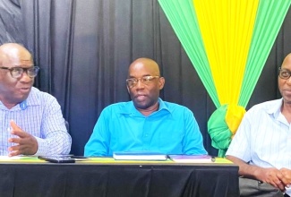 Chairman of the Trelawny Municipal Corporation (TMC) and Mayor of Falmouth, Councillor Collen Gager (left), announces measures to clamp down on illegal business operators along the North Coast Highway, during a meeting on Wednesday (June 5) at the Corporation’s location in Falmouth. The Mayor is joined by Chief Executive Officer of the TMC, Winston Palmer; and Councillor for the Falmouth Division, Garth Wilkinson.