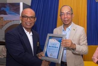 Prayer 6

Deputy Prime Minister and Minister of National Security, Hon. Dr. Horace Chang (right), is presented with a Certificate of Appreciation by Chairman, St. Catherine Baptist Association Brotherhood, Dr. Kirkland Anderson, after delivering the keynote address during Saturday’s (June 8) fourth anniversary prayer breakfast fundraiser at Phillippo Baptist Church in Spanish Town, St. Catherine.