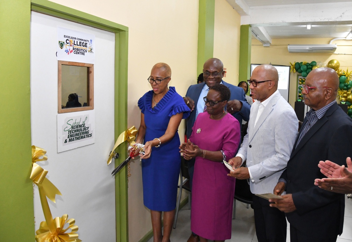 Minister of Education and Youth, Hon. Fayval Williams (left), cuts the ribbon to officially open the Science, Technology, Engineering and Mathematics (STEM) Robotics Centre at Excelsior Community College’s Eureka Road Campus in Kingston on Thursday (June 13). Sharing in the exercise (from second left) are Principal, Philmore McCarthy; President, Jamaica Methodist District in the Caribbean and the Americas, Rev. Bishop Christine Gooden Benguche; Chief Executive Officer, e-Learning Jamaica Limited, Andrew Lee; and Chairman, Committee of Management, Lloyd Davis. 
