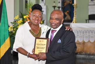 Minister of Culture, Gender, Entertainment and Sport, Hon. Olivia Grange (left), presents a plaque to former Executive Director, Institute of Jamaica (IOJ), Vivian Crawford, during the IOJ’s 145th anniversary commemorative service at the Kingston Parish Church on Sunday (June 2).