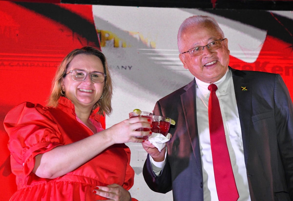 High Commissioner of Canada in Jamaica, Her Excellency Emina Tudakovic (left) and Minister of Justice, Hon. Delroy Chuck, share a toast during a Canada Day Reception held on Tuesday (June 25) at the official residence of the Canadian High Commissioner in Kingston.

