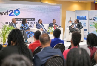 Minister of Finance and the Public Service, Dr. the Hon. Nigel Clarke (second right), participates in a panel discussion during the Ivan+20 Resilience Dialogue and Time Capsule Event on Wednesday (June 5) at the University of the West Indies (UWI) Regional Headquarters in St. Andrew. With him are (from left) Caribbean Development Bank (CDB) Country Representative, Stephen Lawrence; Executive Director, Caribbean Disaster Emergency Management Agency (CDEMA), Elizabeth Riley; Chief Executive Officer, Caribbean Catastrophe Risk Insurance Facility (CCRIF SPC) Isaac Anthony; and Dean, Faculty of Science and Technology, UWI, Mona, Professor Michael Taylor. 