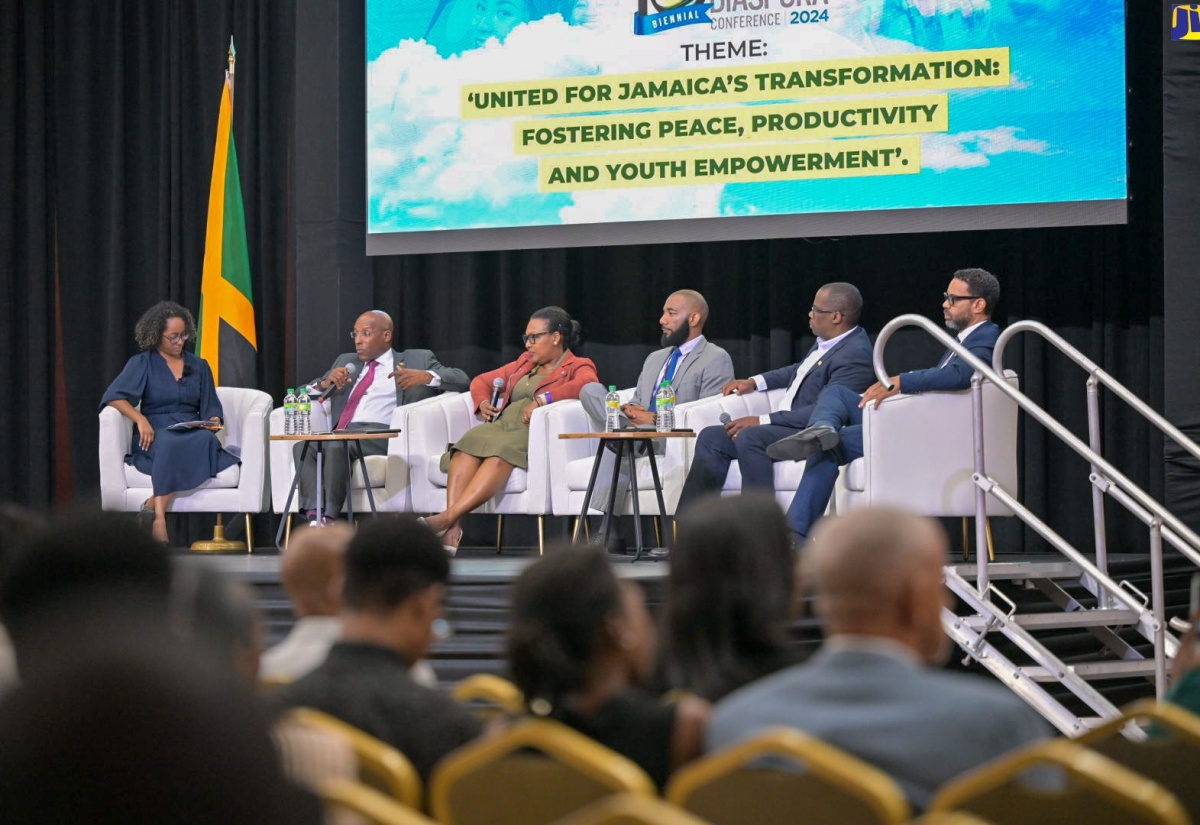 Minister of Industry, Investment and Commerce, Senator the Hon. Aubyn Hill (second left), participates in a panel discussion on transforming investment and enterprise in Jamaica through diaspora engagement, during Monday’s (June 17) opening day of the 10th Biennial Jamaica Diaspora Conference at the Montego Bay Convention Centre in St. James.  He is joined by (from left) Panel Moderator and JAMPRO President, Shullette Cox; Chief Executive Officer of Grace Kennedy Financial Group, Grace Burnett; Owner of Travellers Beach Resort and Founder of Throp Media, Winthrope Wellington; Chief Executive Officer of VM Finance Limited and VM Overseas Offices at the VM Group, Leighton Smith; and Managing Director of JN Fund Managers at JN Group, Brando Hayden.

