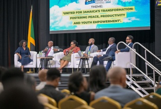 Minister of Industry, Investment and Commerce, Senator the Hon. Aubyn Hill (second left), participates in a panel discussion on transforming investment and enterprise in Jamaica through diaspora engagement, during Monday’s (June 17) opening day of the 10th Biennial Jamaica Diaspora Conference at the Montego Bay Convention Centre in St. James.  He is joined by (from left) Panel Moderator and JAMPRO President, Shullette Cox; Chief Executive Officer of Grace Kennedy Financial Group, Grace Burnett; Owner of Travellers Beach Resort and Founder of Throp Media, Winthrope Wellington; Chief Executive Officer of VM Finance Limited and VM Overseas Offices at the VM Group, Leighton Smith; and Managing Director of JN Fund Managers at JN Group, Brando Hayden.


