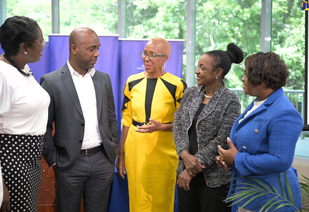 Minister of Education and Youth, Hon. Fayval Williams (centre), converses with (from left) Acting Chief Education Officer, Terry Ann Thomas Gayle; Education Transformation Oversight Committee (ETOC) Chair, Dr. Adrian Stokes; Minister of State in the Ministry, Hon. Marsha Smith and Chief Transformation Officer, Sophia Forbes-Hall.