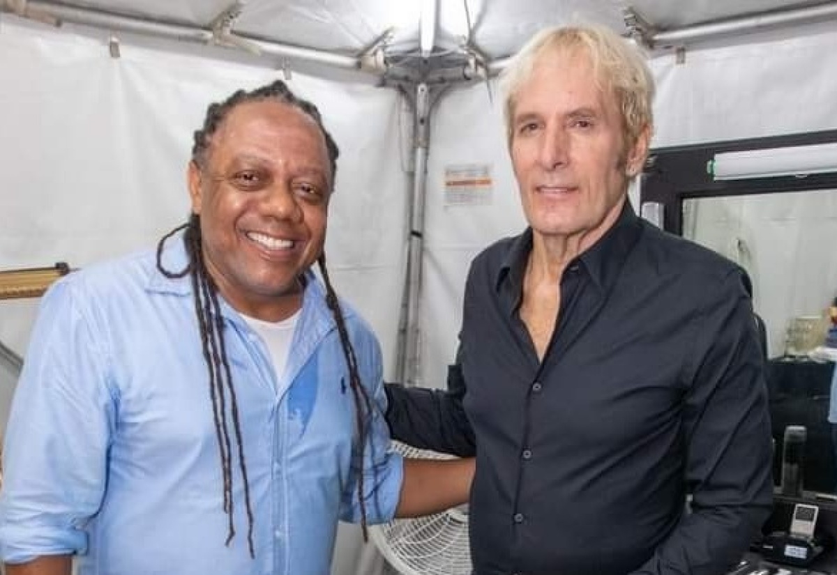 Well-known American singer Michael Bolton (right) shares a moment with Marketer, Sean Edwards, prior to the start of the recent Issa Trust Foundation benefit concert at Sans Souci Resort in St. Mary.

