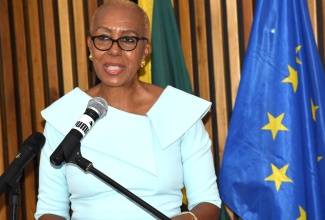 Minister of Education and Youth, Hon.  Fayval Williams, addresses the handover of a cheque for $4.5 million by the European Union (EU) to facilitate the staging of three literacy summer camps in Kingston for primary-school students. The official handover ceremony was held on June 25 at the offices of the European Union Delegation in Kingston.