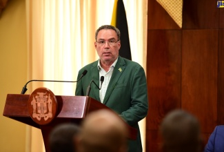 Minister of Science, Energy, Telecommunications and Transport, Hon. Daryl Vaz, addresses a press conference at Jamaica House on Monday (July 1).