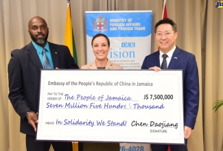 Minister of Foreign Affairs and Foreign Trade, Senator the Hon. Kamina Johnson Smith (centre), and Acting Director General of the Office of Disaster Preparedness and Emergency Management (ODPEM), Richard Thompson (left), receive a cheque valued at $7.5 million from Chinese Ambassador to Jamaica, Chen Daojiang, to assist Jamaica’s Hurricane Beryl recovery efforts.  The handover ceremony was held at the Ministry’s offices in downtown Kingston on Tuesday (July 16).

