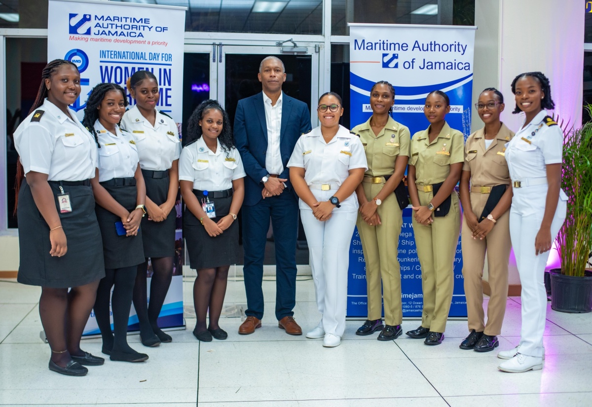 Director General of the Maritime Authority of Jamaica (MAJ), Bertrand Smith (centre), hosts students of the Caribbean Maritime University (CMU) at a recent MAJ function. 