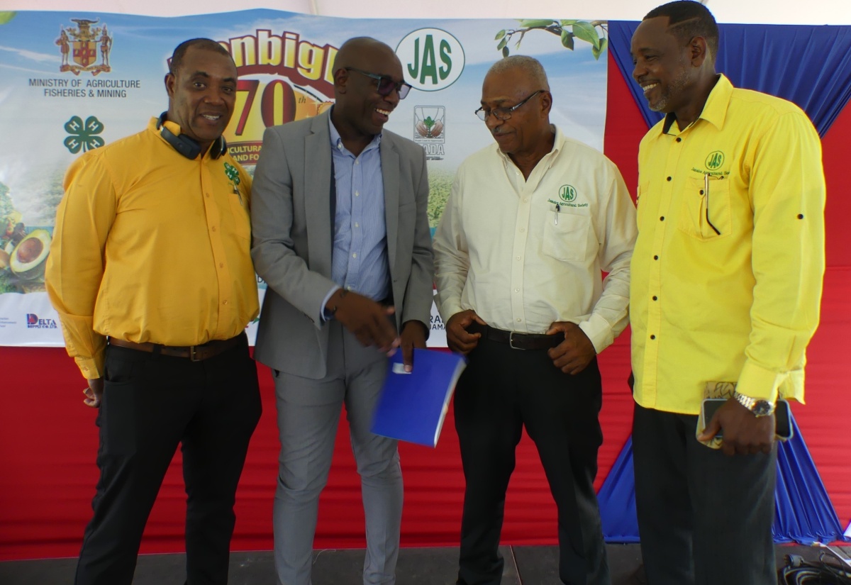 Acting Chief Executive Officer of the Jamaica Agricultural Society (JAS), Derron Grant (second left), is in light discussion with (from left) Executive Director of the Jamaica 4-H Clubs, Peter Thompson; First Vice-President of the JAS, Denton Alvaranga; and Second Vice-President of the organisation, Owen Dobson. Occasion was the recent launch of the 2024 staging of the Denbigh Agricultural, Industrial and Food Show at the Hi-Pro Ace Supercentre in White Marl, St. Catherine.

