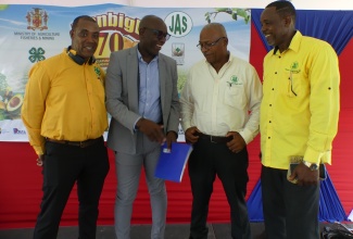 Acting Chief Executive Officer of the Jamaica Agricultural Society (JAS), Derron Grant (second left), is in light discussion with (from left) Executive Director of the Jamaica 4-H Clubs, Peter Thompson; First Vice-President of the JAS, Denton Alvaranga; and Second Vice-President of the organisation, Owen Dobson. Occasion was the recent launch of the 2024 staging of the Denbigh Agricultural, Industrial and Food Show at the Hi-Pro Ace Supercentre in White Marl, St. Catherine.

