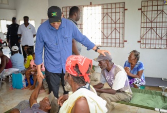 Prime Minister, the Most Hon. Andrew Holness, greets elderly residents of Rocky Point, Clarendon, during a visit to the community centre on Saturday (July 6). The facility is serving as a shelter for displaced citizens following the passage of Hurricane Beryl.

 