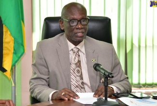Local Government and Community Development Minister, Hon. Desmond McKenzie, addresses a National Disaster Risk Management Council (NDRMC) meeting at the Ministry’s offices in Kingston on Monday (July 1).