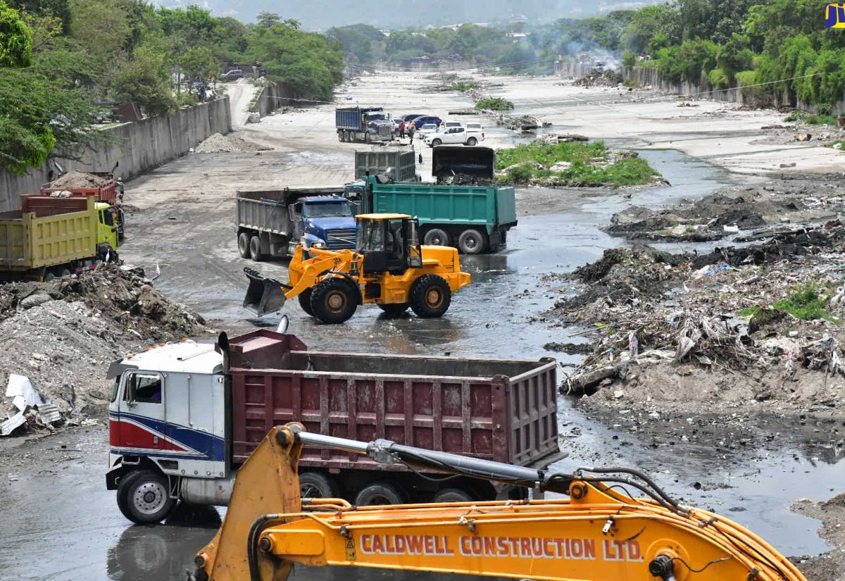 The National Works Agency (NWA) team using heavy equipment to clear the Sandy Gully in the vicinity of Spanish Town Road in Kingston on Tuesday (July 2), ahead of the passage of Hurricane Beryl.