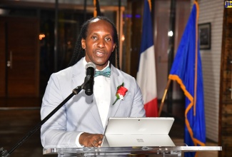 Minister of State in the Ministry of Foreign Affairs and Foreign Trade, Hon. Alando Terrelonge, delivers the main speech at the annual Bastille Day celebration held at the French Embassy in St. Andrew on Sunday (July 14). The occasion was themed ‘A Night in Paris’.