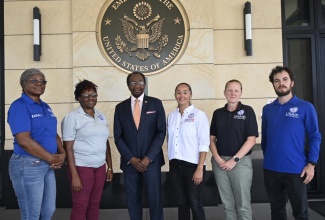Ambassador N. Nick Perry (third left), poses with 5 of the 12 members from the USAID's 
Bureau of Humanitarian Assistance team of disaster experts deployed here in Jamaica since prior to 
Hurricane Beryl.