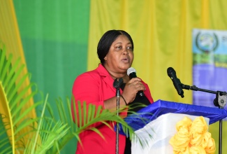 Inspector of Police, Florence Clarke, who is attached to the Centre for the Investigation of Sexual Offences and Child Abuse (CISOCA), addresses the recent St. Andrew South District Consultative Committee Conference at the Pembroke Hall High School.

