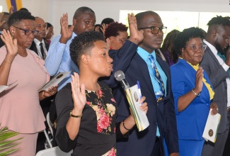 Justices of the Peace take the Oath of Office at a commissioning ceremony, on July 17 at the Church of God of Prophecy in Old Harbour, St. Catherine.

