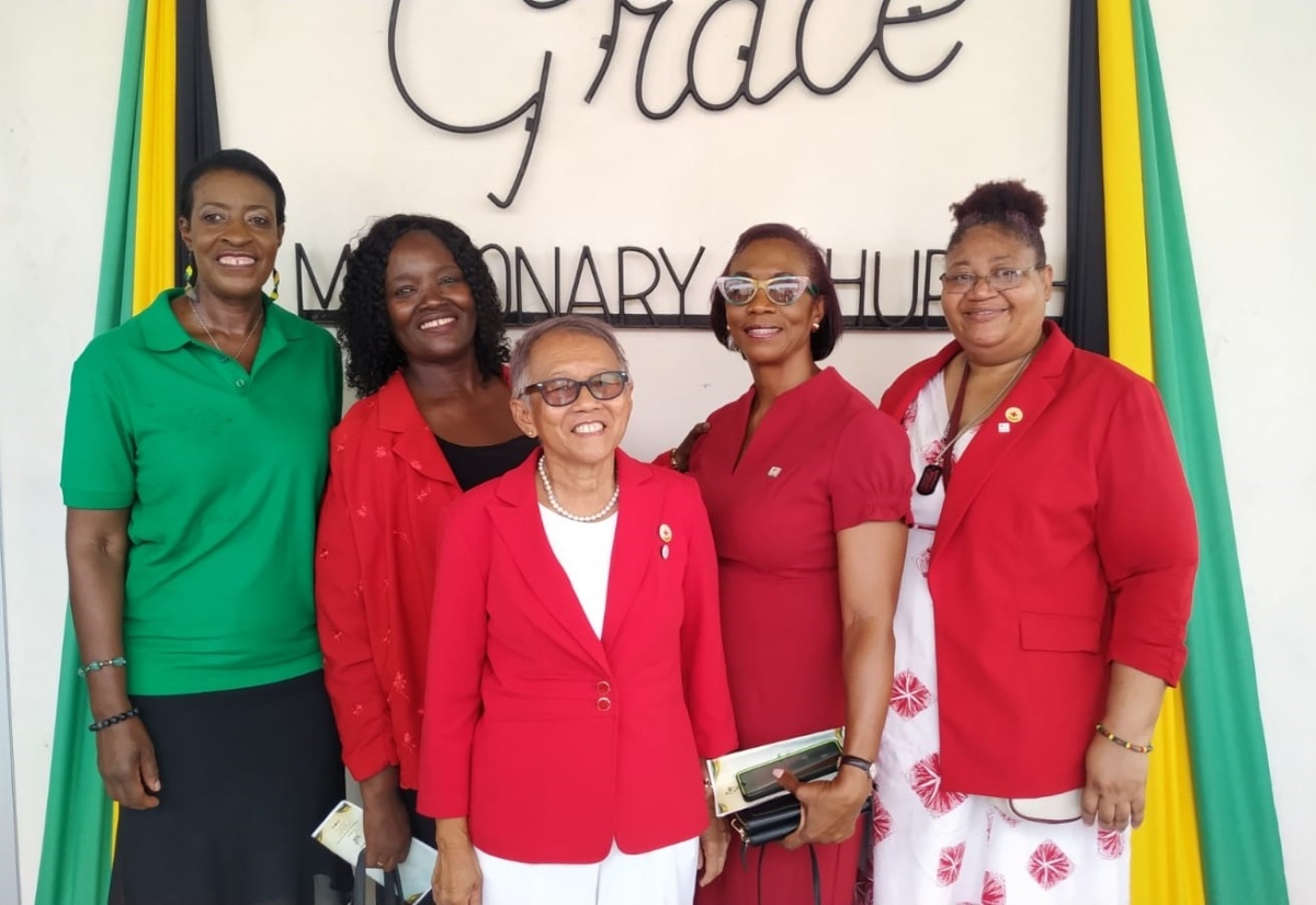 National President of the Jamaica Red Cross (JRC), Allasandra Chung (centre) and JRC volunteers share a photo opportunity at the Emancipation and Independence Thanksgiving Church Service held at the Grace Missionary Church in Kingston on Sunday (July 28). A special donation, collected at the church for Hurricane Beryl victims, was handed over to the JRC.