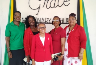 National President of the Jamaica Red Cross (JRC), Allasandra Chung (centre) and JRC volunteers share a photo opportunity at the Emancipation and Independence Thanksgiving Church Service held at the Grace Missionary Church in Kingston on Sunday (July 28). A special donation, collected at the church for Hurricane Beryl victims, was handed over to the JRC.