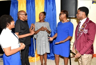Minister of State in the Ministry of National Security, Hon. Juliet Cuthbert-Flynn (second right), engages with (from left) National Secondary Students’ Council (NSSC) Region 5 Vice President, Anna-Ruth Parchment; Founder and Executive Director of the Jamaican Association for Debating and Empowerment (JADE), Germaine Barrett; media personality, Empress Golding; and Vice President of the NSSC for Region 3, Oshane Hall. Occasion was the National Taskforce Against Trafficking in Persons (NAFATIP) Youth Symposium held at the University of Technology (UTech) campus in Kingston on Tuesday (July 30).

