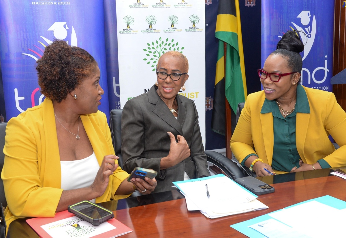 Minister of Education and Youth, Hon. Fayval Williams (centre), and Permanent Secretary in the Education Ministry, Dr. Kasan Troupe (right), converse with Executive Director, National Education Trust (NET), Latoya Harris-Ghartey, during Friday’s (July 19) Hurricane Beryl Disaster Recovery Plan for the Education Sector press conference. The event was held at the Ministry’s offices in Kingston.