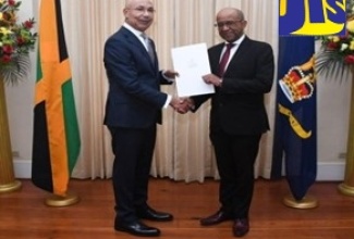 Governor-General, His Excellency the Most Hon. Sir Patrick Allen (left), presents a Proclamation declaring July as Dispute Resolution Month to Dispute Resolution Foundation (DRF) Board Chairman, John Bassie, during a recent courtesy call at King’s House.