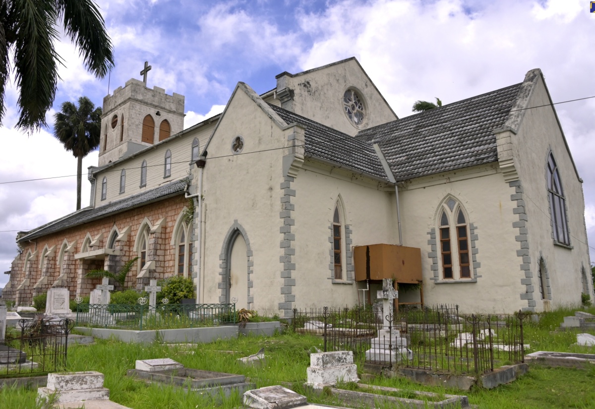 Strategically located in the heart of Mandeville, the capital town of Manchester, is the St. Mark's Anglican Church. The majestic stone structure was completed and consecrated in 1820, with the chancel and timber clerestory added later and the tower raised. The building, which serves as the Manchester Parish Church, features classic gothic accents such as the pointed arch doors and window openings, which distinguishes it from other Jamaican churches built at the time.  The graves in the churchyard, which include tombs of British soldiers who died from yellow fever, tell the tale of the mix of cultures that make up the Jamaican story. The beautiful and historic building is a national landmark.