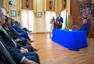 Prime Minister, the Most Hon. Andrew Holness (at the podium), addresses Monday’s (July 8) launch of the ‘Building a Better Jamaica Fund’ at Jamaica House. Seated (at right) is National Commercial Bank (NCB) Financial Group Chairman, Michael Lee-Chin.

