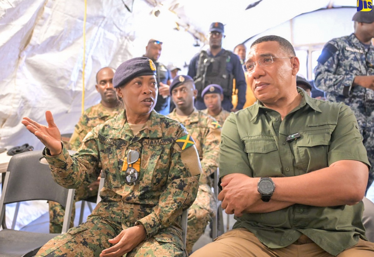 Prime Minister the Most Hon. Andrew Holness (right) is briefed by Chief of Defence Staff (CDS), Vice Admiral Antonette Wemyss Gorman, during a visit to the Jamaica Defence Force (JDF) site in Rocky Point, Clarendon today (July 13). The JDF, including members of the Disaster Assistance Relief Team (DART), has been on the ground providing emergency assistance, clearing debris, and restoring essential services, following the passage of Hurricane Beryl on July 3.