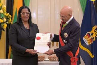 Governor-General, His Excellency the Most Hon. Sir Patrick Allen (right), presents newly appointed President of the Court of Appeal, Hon. Justice Marva McDonald Bishop, with the Instrument of Appointment at the swearing-in ceremony held at King’s House on July 18.


