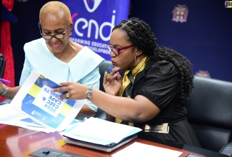 Minister of Education and Youth, Hon. Fayval Williams (left), and Permanent Secretary in the Ministry, Dr. Kasan Troupe, peruse a document during Monday’s (August 26) press conference to provide a report on Jamaica’s performance in the May/June 2024 CSEC and CAPE examinations, at the Ministry’s offices in Kingston.

