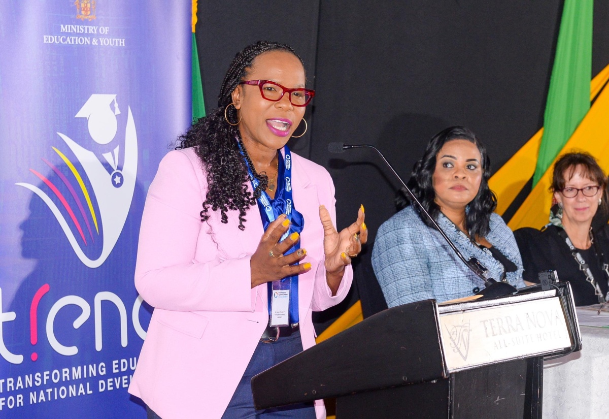 Permanent Secretary in the Ministry of Education and Youth, Dr. Kasan Troupe (left), delivers the keynote address during Wednesday’s (August 7) National Preparatory Session for the Global Ministerial Conference on ‘Ending Violence Against Children’, held at the Terra Nova All-Suite Hotel in Kingston. Listening  (from second left) are Chief Executive Officer of the Child Protection and Family Services Agency, Laurette Adams-Thomas, and UNICEF Jamaica Country Representative, Olga Isaza.

