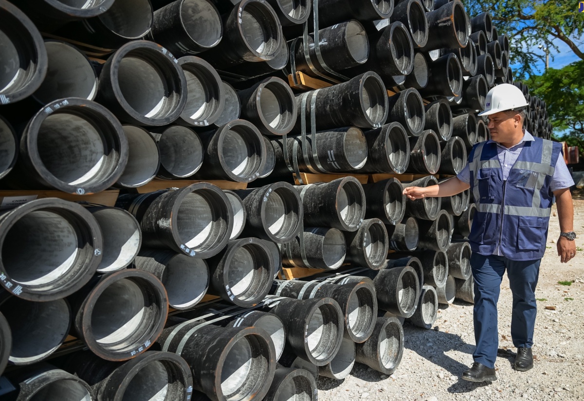 Minister without Portfolio in the Ministry of Economic Growth and Job Creation, Senator the Hon. Matthew Samuda, inspects pipes designated for a major water infrastructure project at the Mona Reservoir in St. Andrew, during a visit to the facility on Wednesday (August 28).

