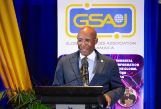Minister of Industry, Investment and Commerce, Senator the Hon. Aubyn Hill, addresses the Global Services Association of Jamaica (GSAJ) Conference and Awards Ceremony held recently at The Jamaica Pegasus hotel in New Kingston.

