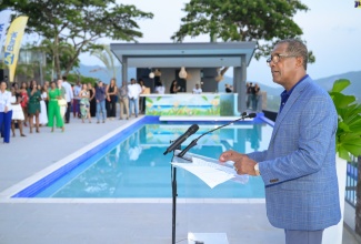 Factories Corporation of Jamaica (FCJ) Chairman, Lyttleton ‘Tanny’ Shirley, brings greetings during the launch of Jamaica Sotheby’s International Realty’s luxury residential development – ‘Spyglass’ - in Jack’s Hill, St. Andrew, on Friday (August 9). The project comprises a mix of apartments and townhouses, and represents an extraordinary blend of modern elegance, innovative design and world-class amenities.